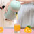 美之扣 橙汁榨汁机手动压橙子器 简易迷你炸果汁杯 小型家用水果柠檬榨汁器(绿色)第5张高清大图