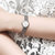 天梭(TISSOT)女表 乐爱系列手表 时尚休闲简约钢带瑞士女士时装表腕表(白色)第2张高清大图