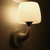 简约白色壁灯LED暖光现代客厅卧室床头灯创意造型儿童房灯海豚灯(白色双头 带5w光源)第2张高清大图