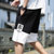 2020夏季新款男士休闲裤子男韩版潮流五分裤黑色短裤男宽松 BKL-K521(白色 XL)第5张高清大图