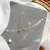 福相似 法式杂志款凤尾珍珠锁骨项链钛钢18k金珍珠项链(金色)第2张高清大图