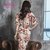 莉菲姿韩版新款时尚性感显瘦喇叭袖露背系带v领印花气质连衣裙(花色)第5张高清大图